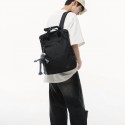 Urban Commuter: Stylish Black Backpack with Plush Charm