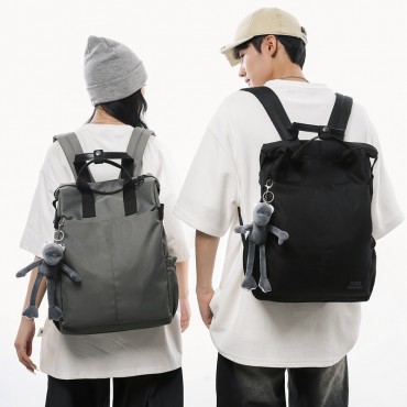 Urban Commuter: Stylish Black Backpack with Plush Charm