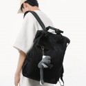 Urban Commuter: Stylish Black Backpack with Plush Charm