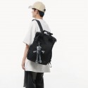 Urban Commuter: Stylish Black Backpack with Plush Charm