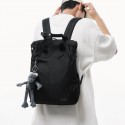 Urban Commuter: Stylish Black Backpack with Plush Charm