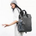 Urban Commuter: Stylish Gray Backpack with Plush Charm