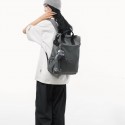 Urban Commuter: Stylish Gray Backpack with Plush Charm