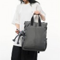 Urban Commuter: Stylish Gray Backpack with Plush Charm