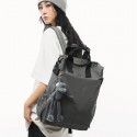 Urban Commuter: Stylish Gray Backpack with Plush Charm