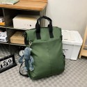 Urban Commuter: Stylish Green Backpack with Plush Charm