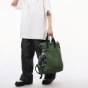 Urban Commuter: Stylish Green Backpack with Plush Charm